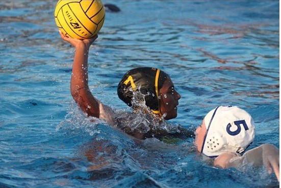 Team Captain of 2 years,  Shreya Ragoonan gets in position to shoot into the goal curving the opposing team player . 