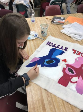 A senior at South Broward works on her final trapunto project on April 13th. Drawing, painting, and stitching together a design of Disney characters. Time and patience is required for detailed projects, such as this one. 