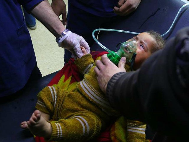 Infant struggles to breath after chemical bombs rain from the skies.
