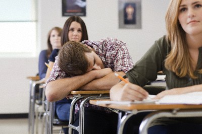 Male high school student asleep in class --- Image by © Image Source/Corbis