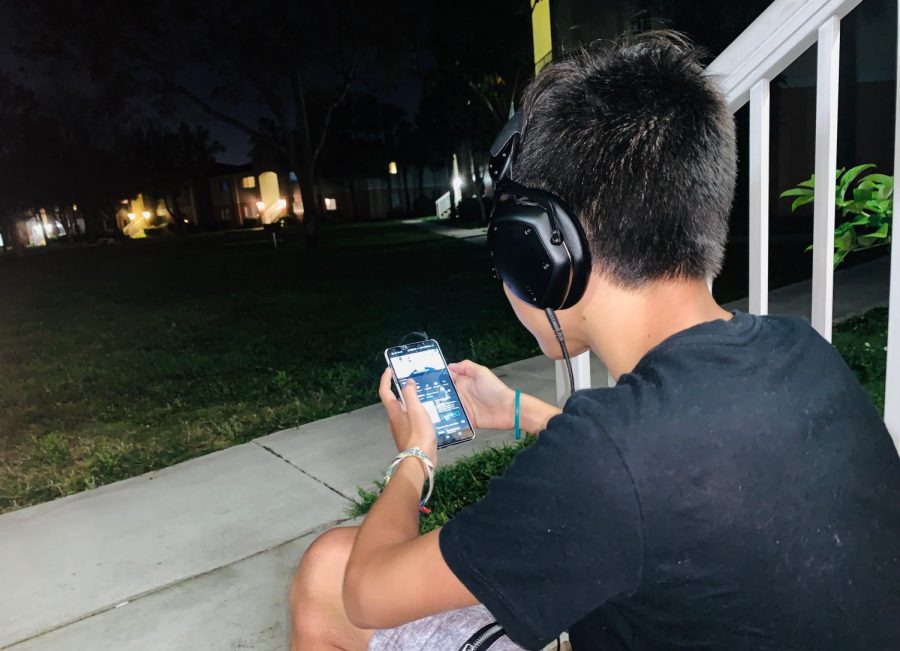 Child of 12 years old using his phones for social media

