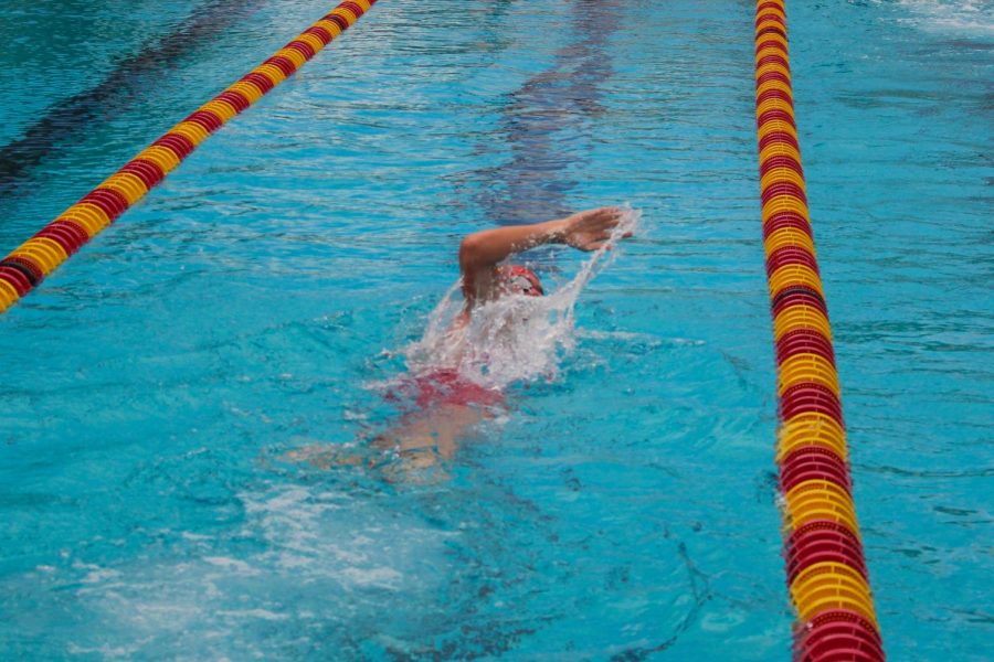 Ashton Gromiak swims the 500 yard boy freestyle finals at South Broward High School on October 10, 2019.