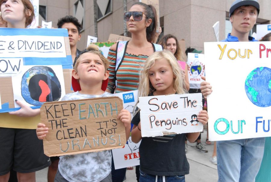 Paxton and Maddox Ingelido protest alongside their mother at the Global Youth Climate Strike on September 20, 2019. The Climate Strike was led by local citizens of all ages in hopes to capture the attention of government officials to promote change. 
