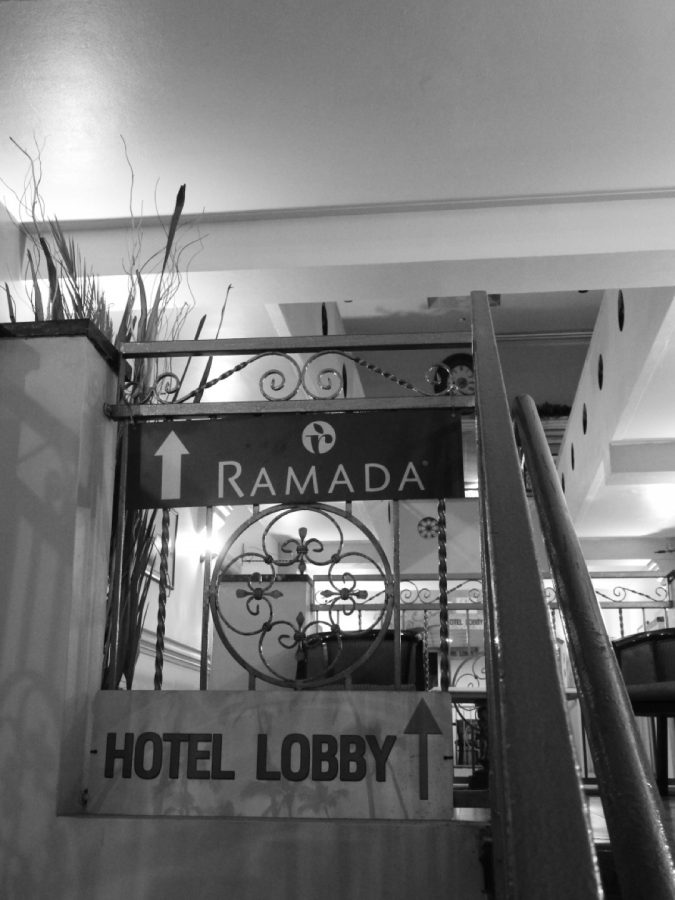 Hotel Ramadas sign pointing to where the hotel lobby is. This hotel has been open since 1965 and people still reserve a room today.