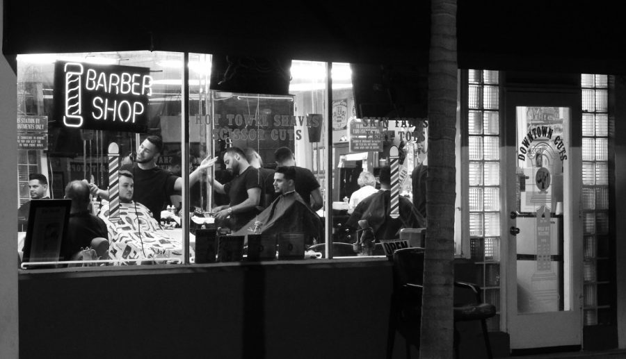 A local barber trims the edges of a customer Downtown Cuts. The barber shop has been open since 1946 and still is open for business to this day.