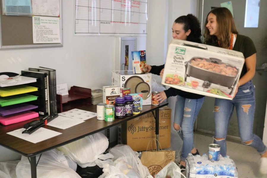 SBHS students Julia Sparkman and Nicole Conney donating for our harvest drive.