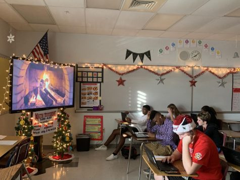 While students work, a big screen television.