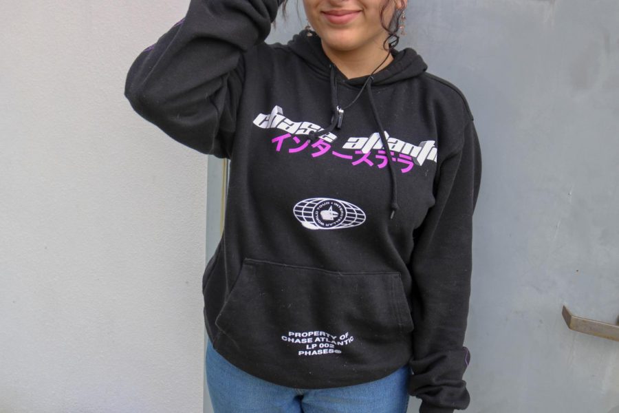 Delayla Omar wears a sweater from her favorite musicians merchandise. 