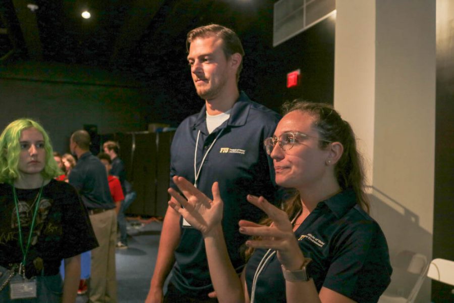 Miranda Cohen listens as engineers from FIU explain irrigation systems during the occurrence of a hurricane.