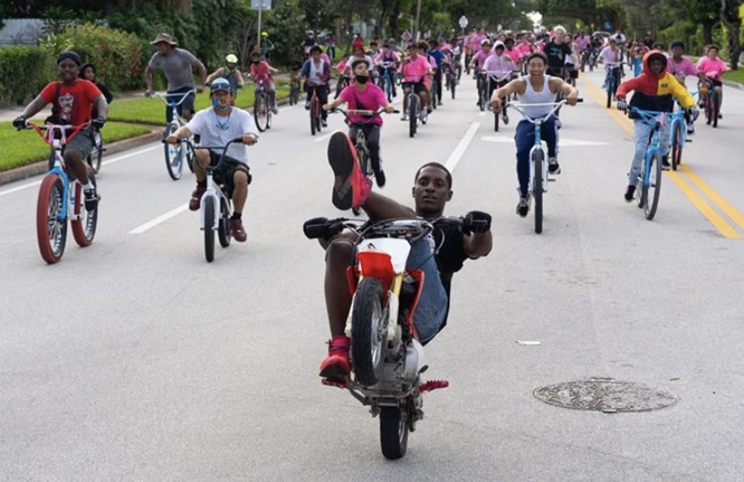 Marlon leading the pack in a mini dirt bike on the way to West Palm Beach Downtown.