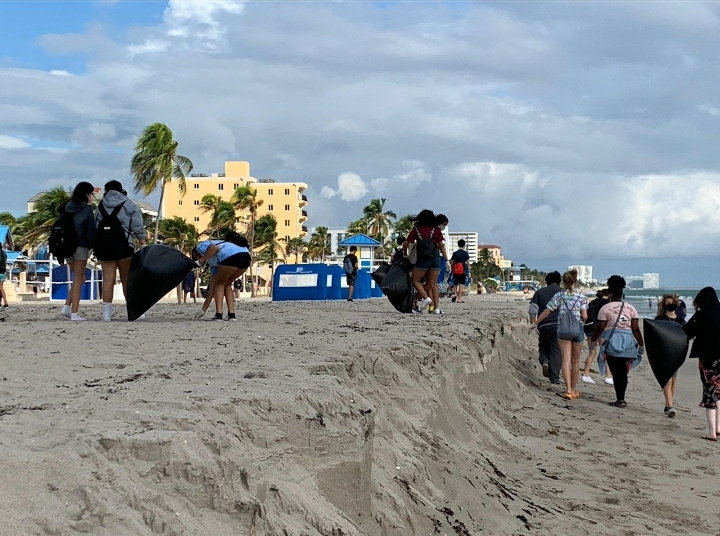 Students pick up trash  at a beach clean up for the PTSO a few weeks ago. They worked in smaller groups to prevent large gatherings.