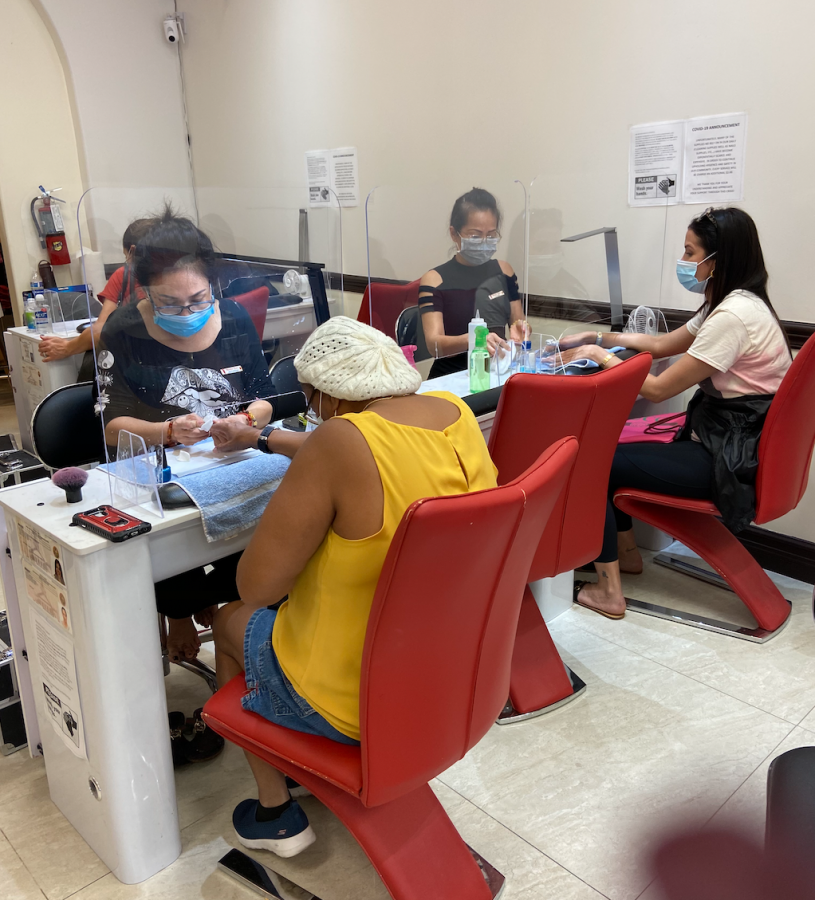 This is a triple desk setup with 2 worker and clients with masks and a empty middle desk 
For social distancing. They are also doing manicures with the shield and say the same as Ms.Campoverde.to be honest work is still the same and im still good at doing what I do.