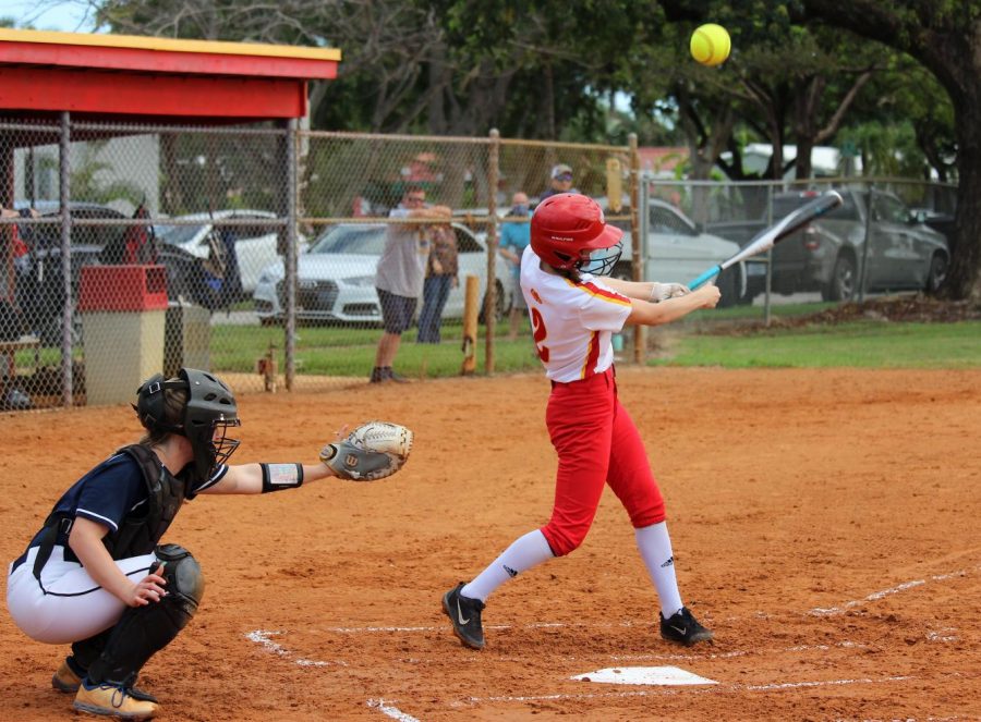 SBHS senior, Kayla Savoie, takes a swing at a pitch and hits a foul ball. Foul balls only count as strikes if it is in place of the first two strikes, but not the third. Savoie will have another chance to hit against the pompano pitcher and get to base. 