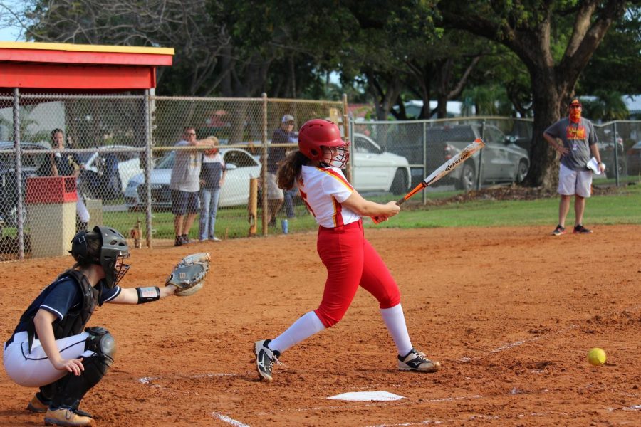 SBHS senior, Reyna Maya, hits the ball into the outfield and runs to first. Mayas hit was caught by the fielders, causing her to be out. Maya transferred to South Broward her sophomore year from Nova High School and joined the SBHS softball team.