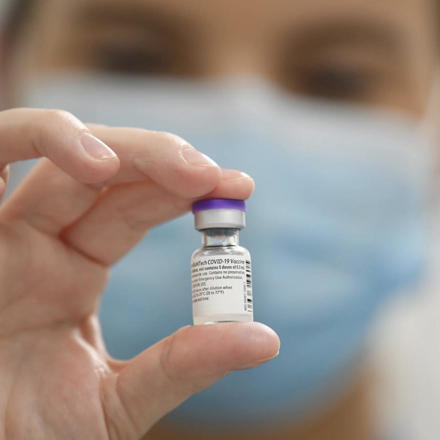 Picture of somebody holding Pfizer Vaccine
