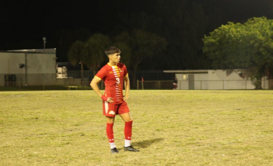 Defender Jose Valladares stands ready to run at any moment watching the play ahead of him