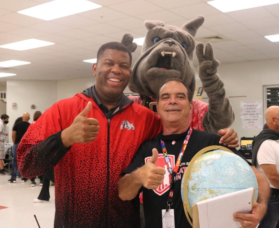 Mr. Baker and Mr. Rodriguez posing with our school mascot in the Magnet Open House, just before it was all over.