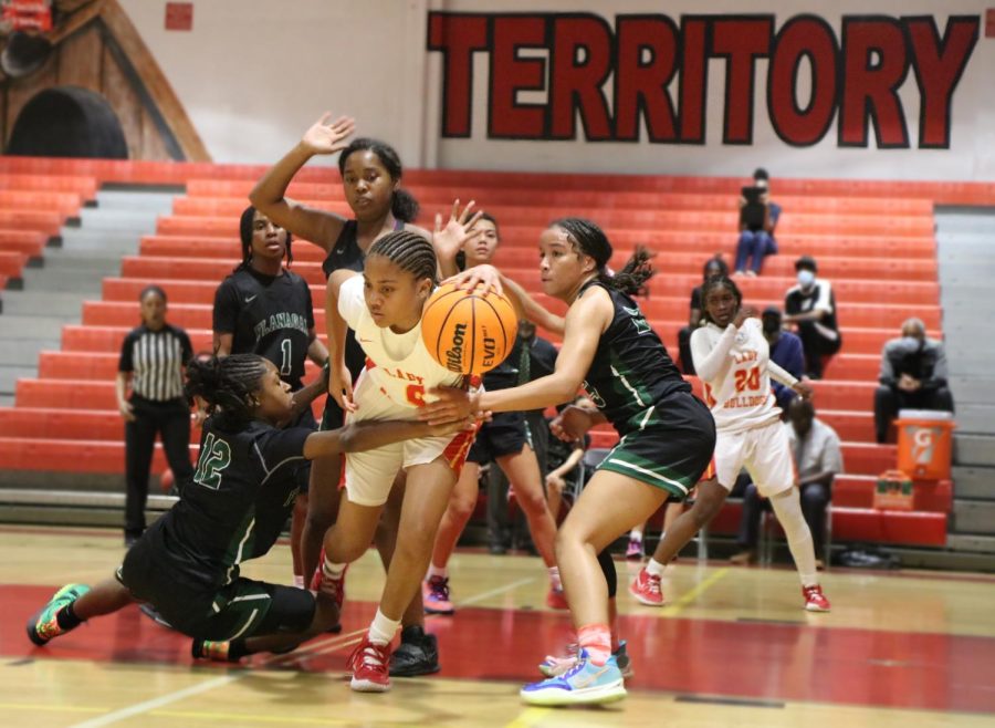 Sophomore Fabiana Poindujour breaks through half of the Falcons defense during the District Championship game. The Bulldogs went on to defeat Flannagan 61-38. 
