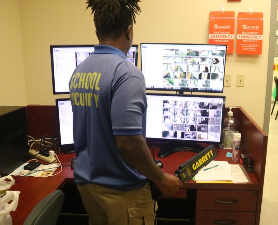 Security officer, Mr. Balvin Smalls, monitors the halls of South Broward with the new handheld metal detectors that the school board approved to have at all Broward County Public Schools.