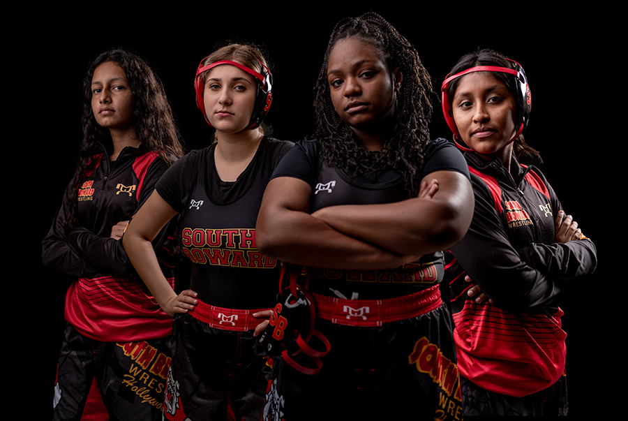 (From left to right): Nicole Arroyo, Hannah Olstein, Veronica Dorcin, and Lucia Cantillano pose adorned in South Broward Wrestling gear.