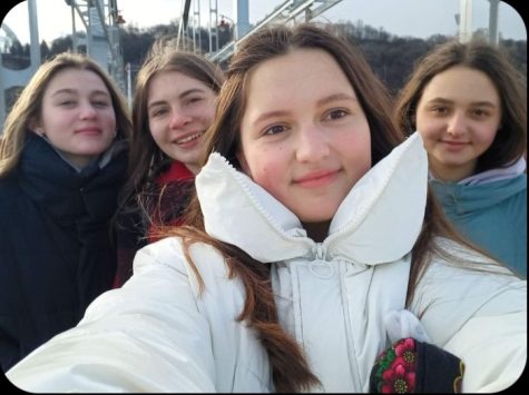 Student, Sophomore Sofia Plastunova enjoys her last time hanging out with her Ukrainian friends at their local fair.