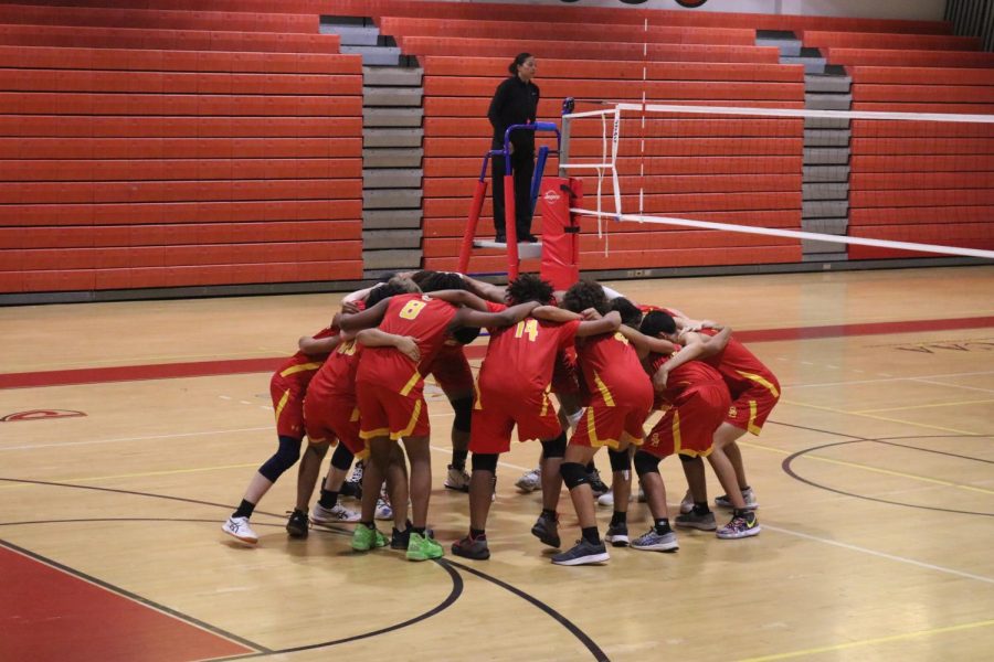 South Broward High School varsity boys volleyball team huddles up for there pre game chant before there tough matchup against Cypress Bay.
