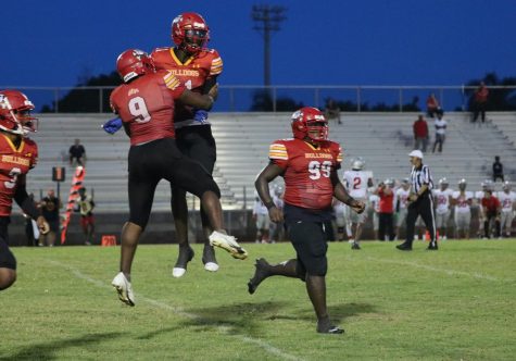 Jade Card and #9 celebrate after scoring a touchdown 