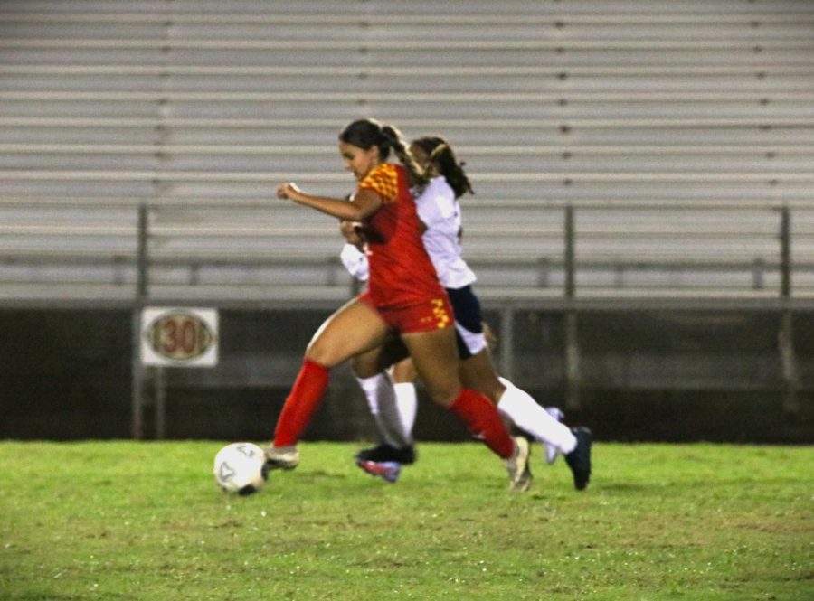 Emma Zulueta steals the ball from her opponent.