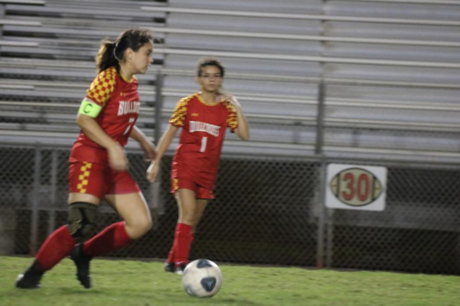 Isabella Nowakowski (7), on the left, heads towards the goal with the ball.