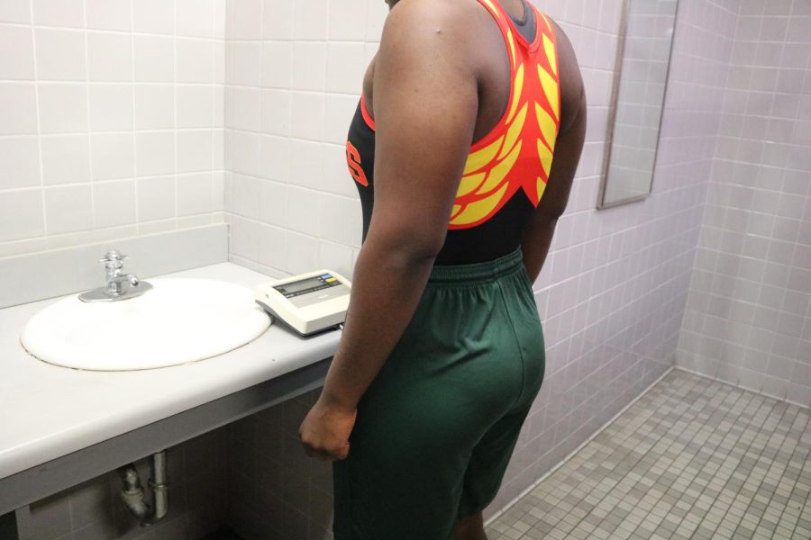 SBHS wrestler Latoya Sylvestre checking to make sure she made weight before weigh-ins.