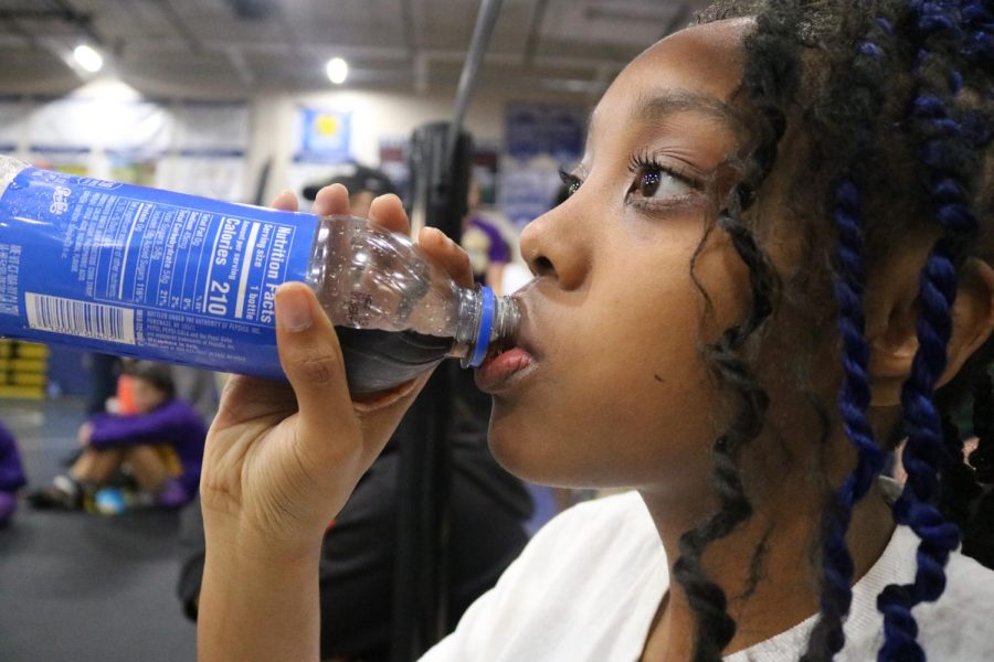 SBHS wrestler Mikyla Thompson drinks Pepsi after regional weigh-ins for her 120 weight division.