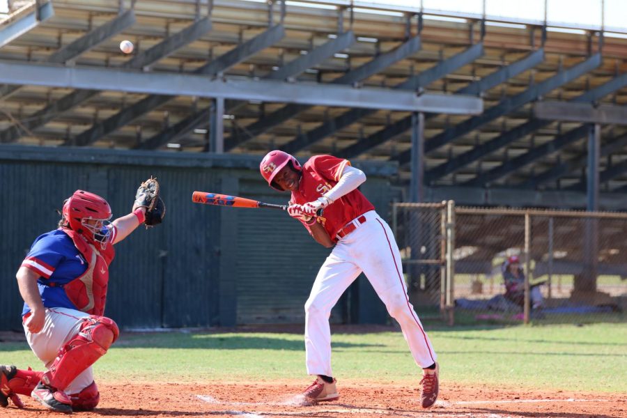 SBHS baseball player Gabriel Lydia gets hit with ball after pitch.