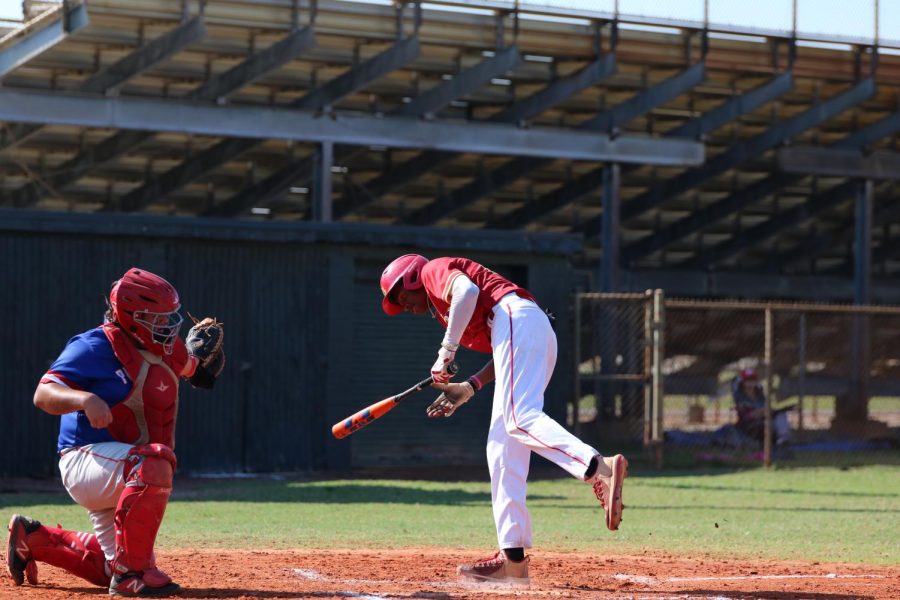 SBHS baseball player Gabriel gets hit with ball after pitch.