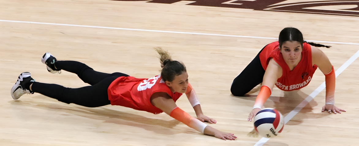 Piper Wilson and Leann Alkobi dive into action to save the play and their team.