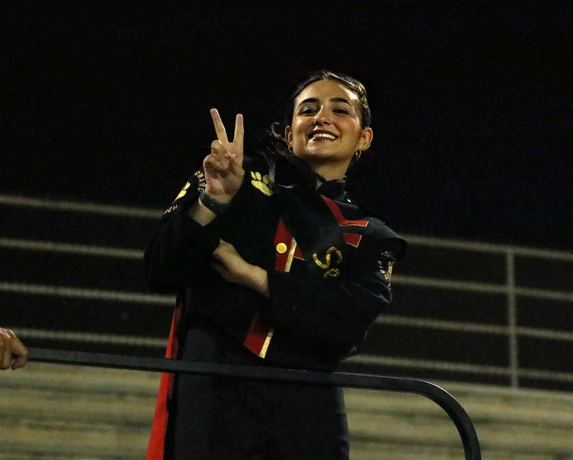 As SBHS's conductor, Drum Major Brittany Ramirez poses in between songs as the Bulldogs go head-to-head with the Patriots.