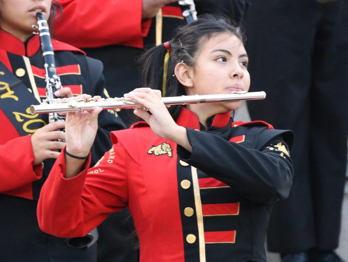 During South Browards opening song, flute player Samantha Jimenez pays close attention to her conductor.