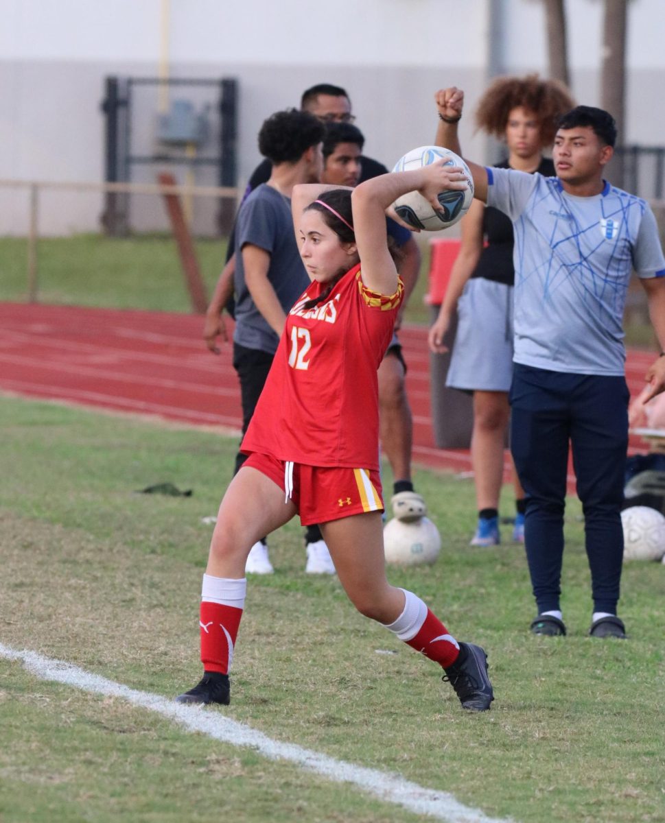 Junior, Isabella Mellcio, locks in and focuses all her attention on the play at hand, clocking her arms back and readying herself for a massive throw-in.