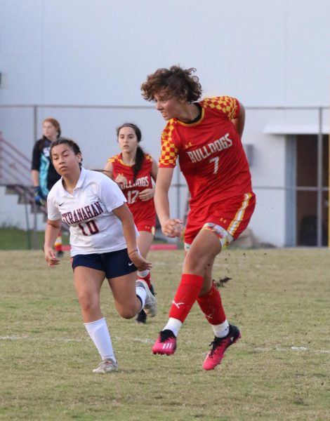 Isabel Capellen, who is both a Captain and Junior at SBHS, delivers a perfect cross to her striker using her full force.