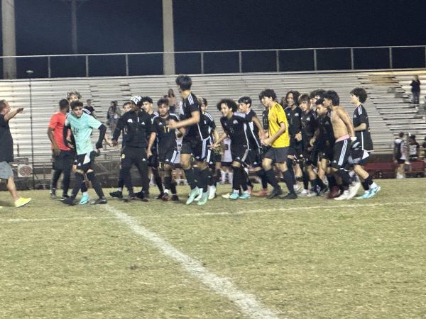 SBHS boys soccer team celebrates after their district win leading them to regionals.
