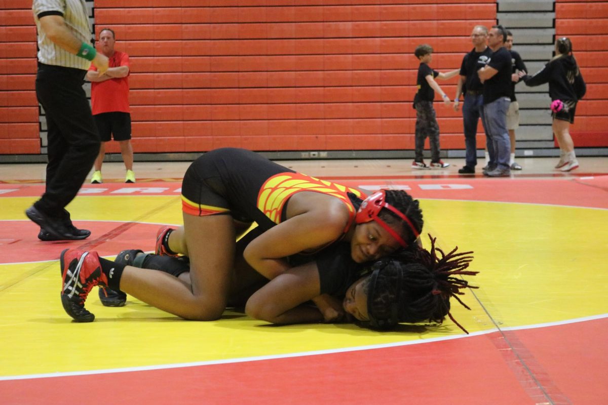 SBHS sophomore athlete, Thavassa settling on top of her opponent trying to roll her to her back.