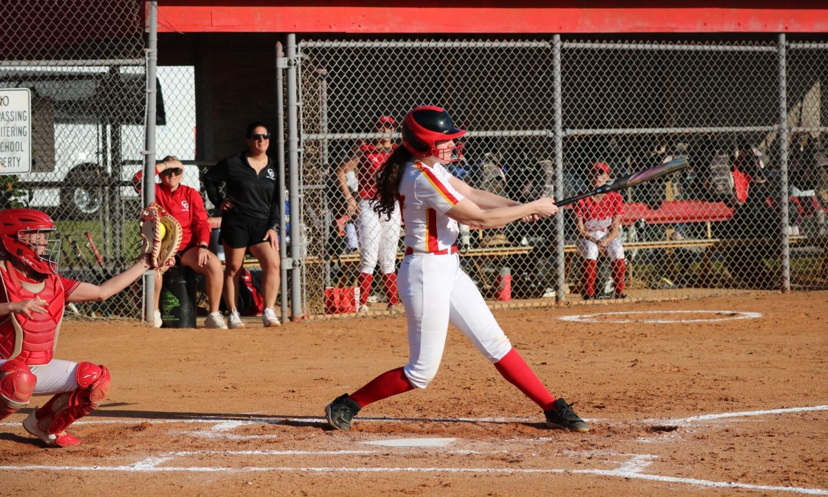 Isabel Wellins showcases her versatility on the diamond, stepping up to the plate with confidence for her turn at bat. Sadly she would strike out.