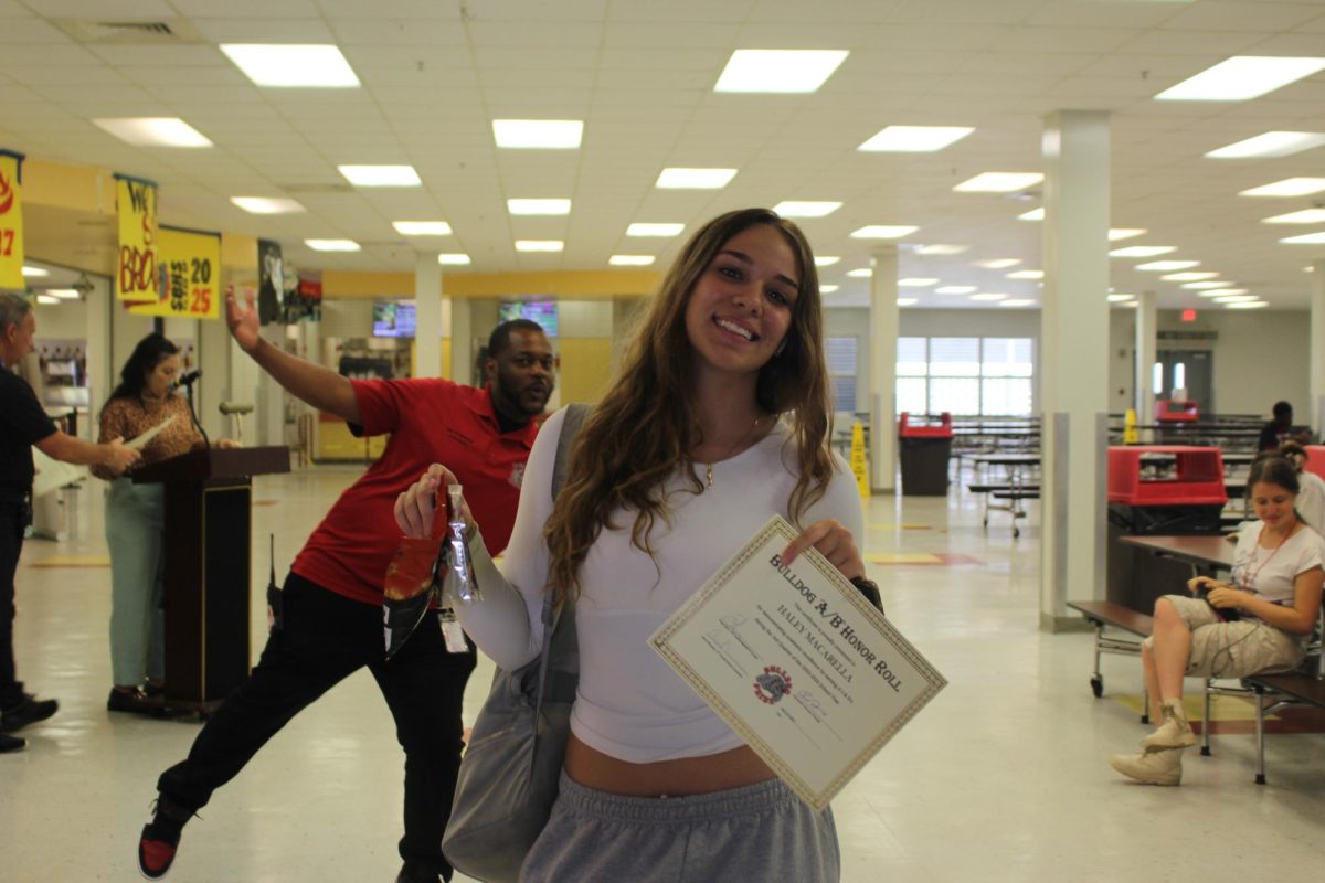When Junior Haley Macarella took a photo with her grant and awards, she was photobombed by Mr. Francois