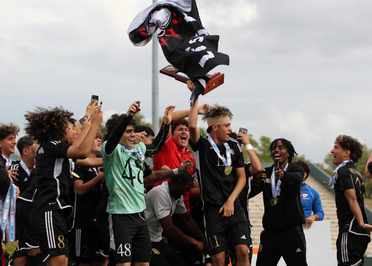 Uncontrollable+euphoria+sweeps+through+the+South+Broward+Boys+Soccer+team+as+captain+Lucas+Costa+hoists+the+coveted+championship+trophy+high+into+the+air%2C+proudly+waving+the+Bulldog+flag+in+a+triumphant+display+of+school+spirit.+The+Bulldogs+beat+the+Viera+Hawks+1-0+in+a+second+overtime+to+take+the+FHSAA+State+Championship+title+for+division+6A.