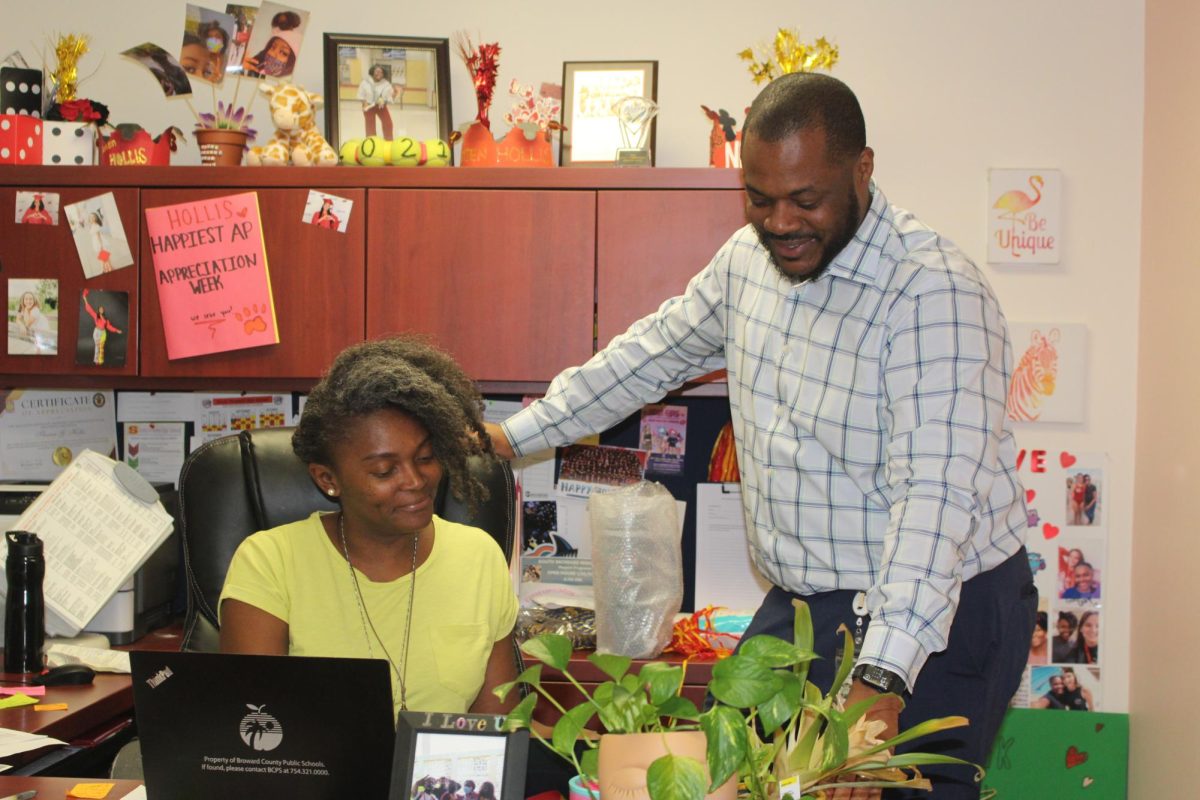 Ms. Hollis and Principal Alexander Francois collaborates together on certificate approvals.