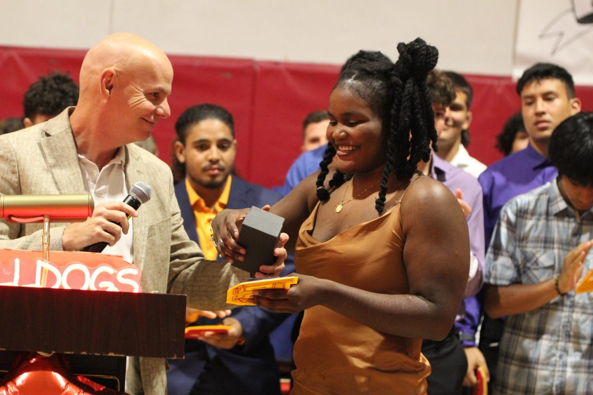 When Latoya Sylvestre was called up, she greeted Coach Major with a smile while he handed off her award.