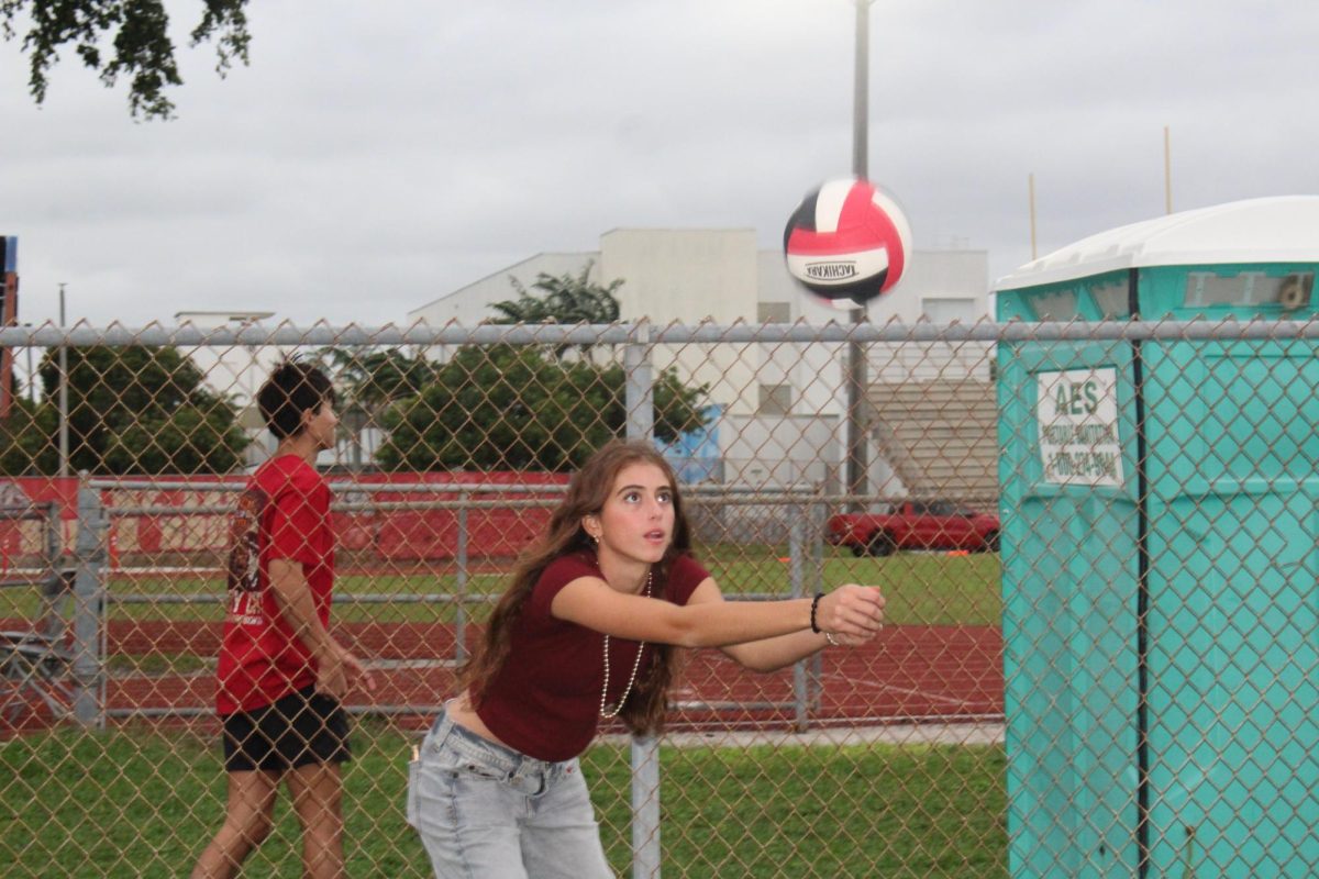 SBHS sophomore student Hannah Onet is playing volleyball for fun while going to receive the ball.