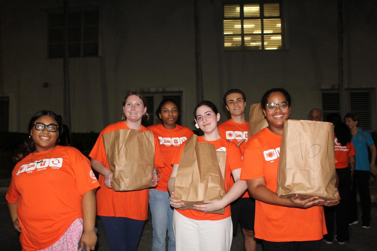 SBHS students of SGA, Jayla Clement, Lindsay Perrin, Cheyenne Cox, Seraphina Wagner, Lucciano DoVidio, and Abbigail Ferguson pose for a photo while waiting for the next car to pull up for them to hand out to families.