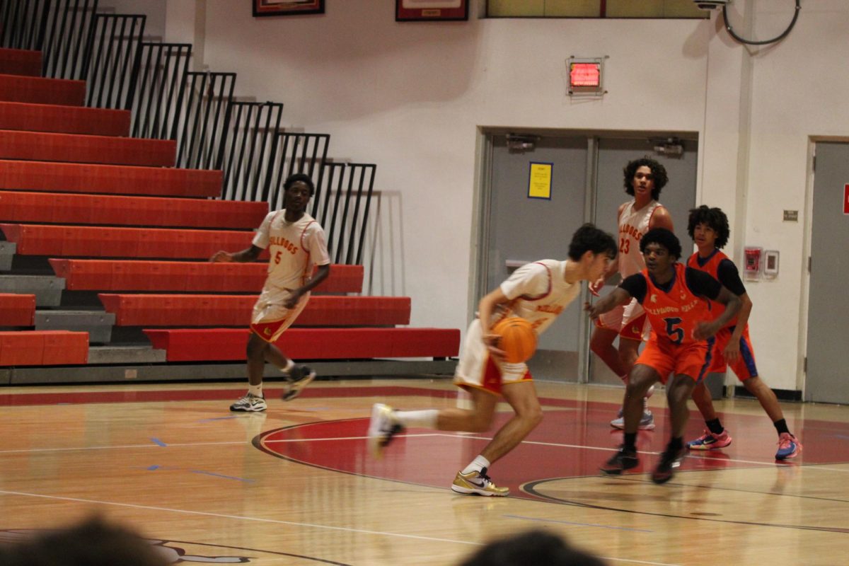 SBHS Junior Trent Jeffers' attempts to get around his opponents to the hoop. 