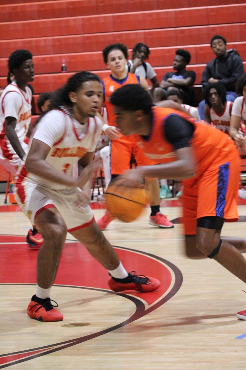 SBHS Junior Nelson Maldonado guarding the ball as an opposing team player attempts to get passed him.