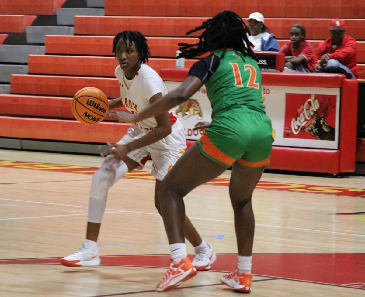 Passion meets purpose on the court as Aniyah Cowart powers past the defense to sink a crucial point.